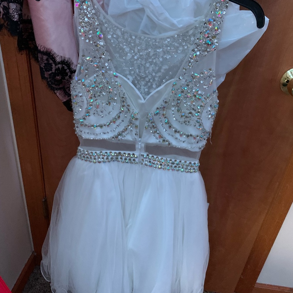 This was my first homecoming dress. Worn twice. White with sequins.